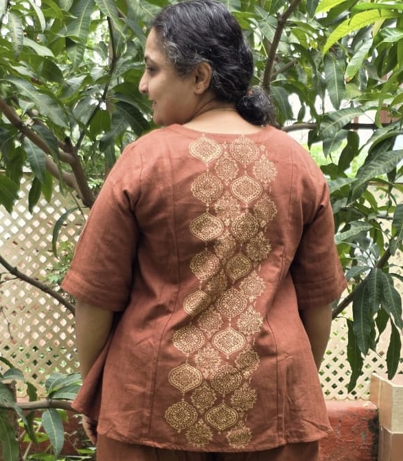 Fresh leaves and flowers laid out on fabric for eco printing